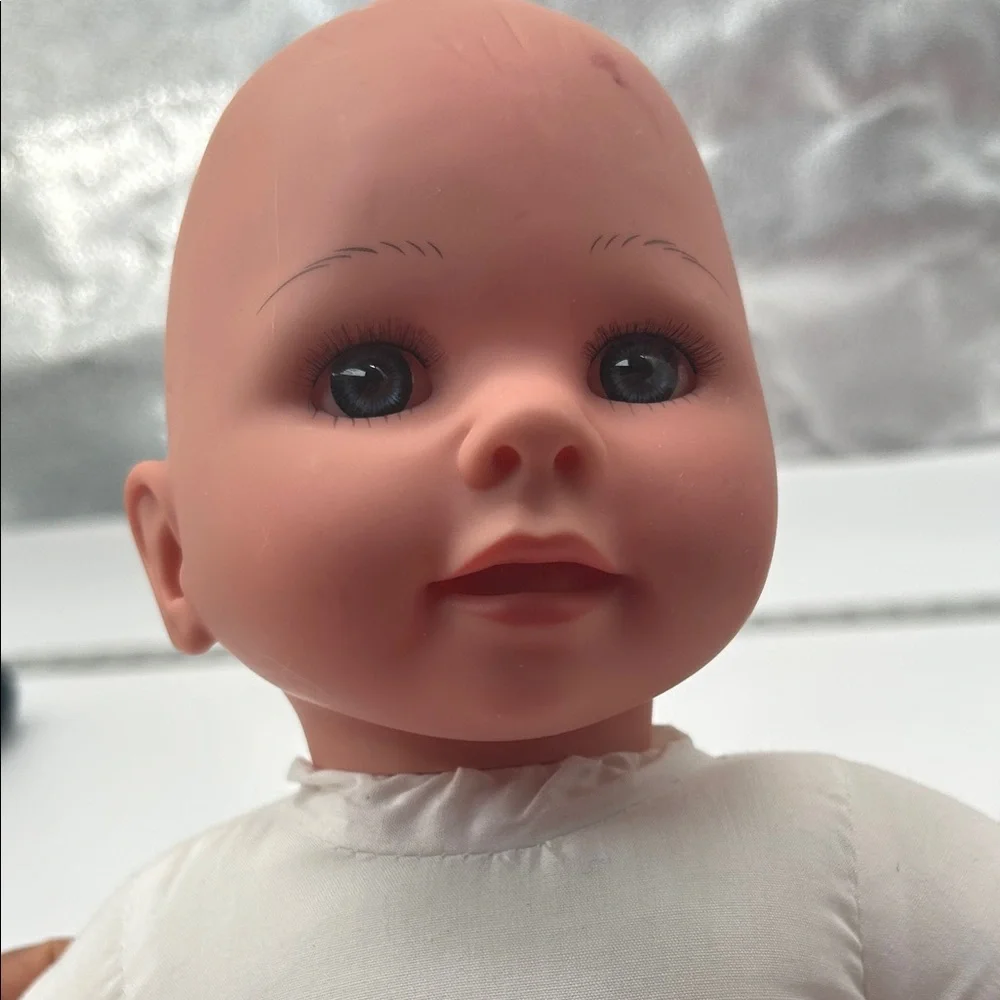 Realistic Baby Doll with White Outfit